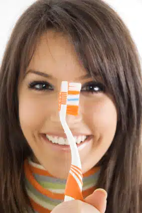 You Never Want to Cover Your Toothbrush After Using It